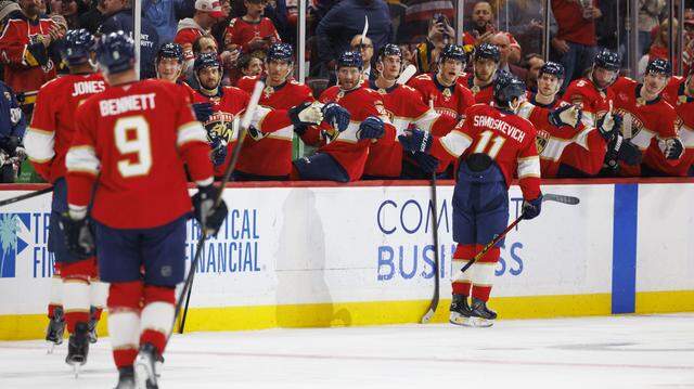 Florida Panthers right wing Mackie Samoskevich (11) high-fives teammates after scoring during the first period of a game against the Ottawa Senators on Florida Panthers Pride Night on Tuesday, March 31, 2026, at Amerant Bank Arena in Sunrise, Fla. The Florida Panthers scored 5 goals in the first period.